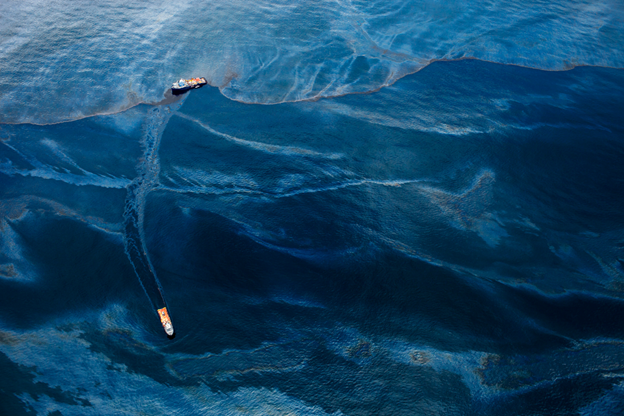 This talk develops a theory of the “fluid cut” based on the materiality of surfactants used to disperse oil during the Deepwater Horizon spill. Whereas photography theory tends to think of the “cut” as the click of a camera shutter that slices through moments in time, “fluid cuts” of surfactants like Corexit relate more to processes of diffusion in the medium of seawater. Through readings of photographic images by Daniel Beltrá and ads by the dish soap company Dawn, I show how surfactants are a literal example of what Charles Ackland names “residual media,” both left behind and viscous. From this perspective, Deepwater Horizon contributes to a notion of the Anthropocene that comes from chemistry rather than geology, with the implication that anthropogenic changes aren’t merely recorded in the geologic record, but actively reconfigure the chemical composition of environments.